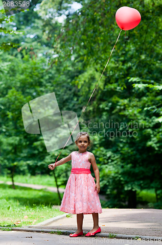 Image of Little girl with balloon