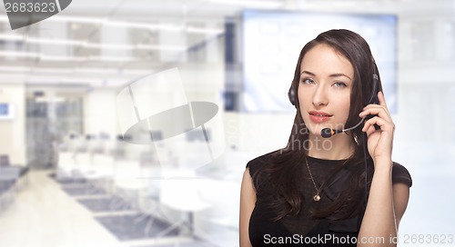 Image of Woman with headset hotline online support