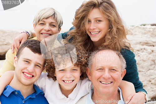 Image of Happy family posing together