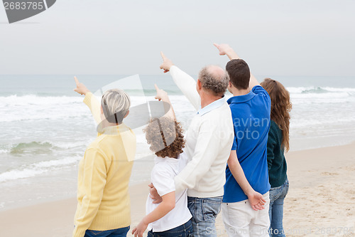 Image of Back view of beautiful family on vacation