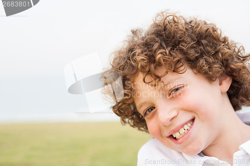 Image of Smiling young pretty boy posing