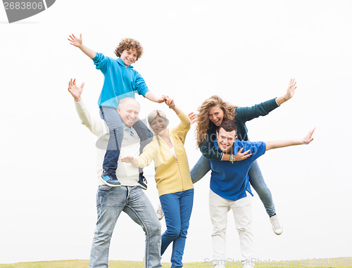 Image of Cheerful family having fun on holiday