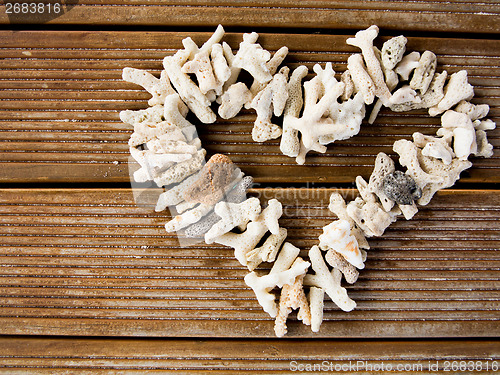 Image of Heart symbol on wooden background