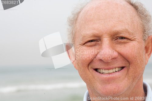 Image of Happy old man posing to camera