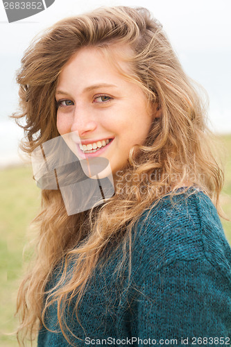 Image of Beautiful young smiling woman