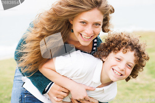 Image of Loving mother and son playing