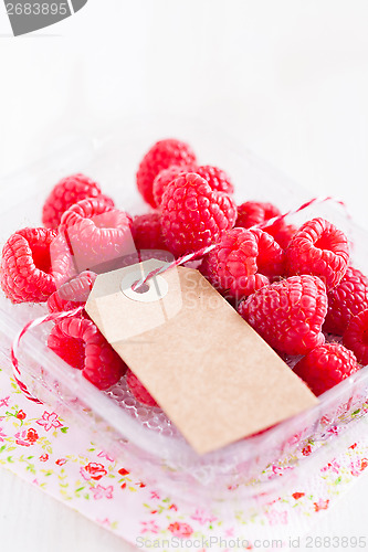 Image of Fresh raspberries and cardboard tag