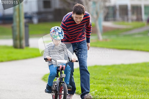 Image of family biking