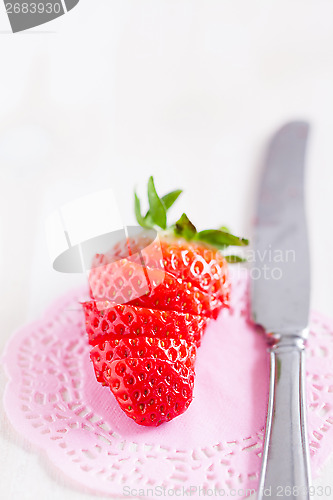 Image of Sliced strawberry and knife