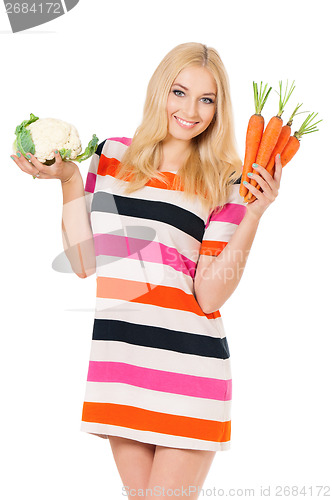 Image of Woman with cabbage and carrots