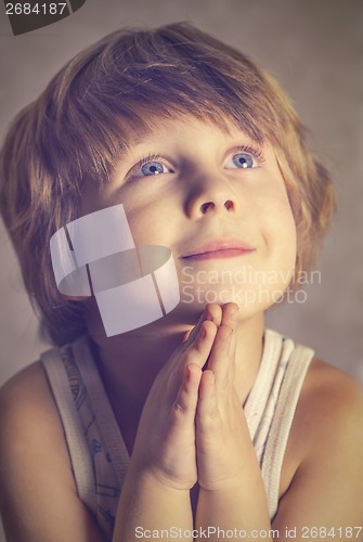 Image of boy at prayer