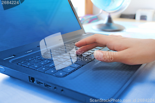 Image of typing female fingers