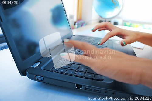 Image of typing female hands