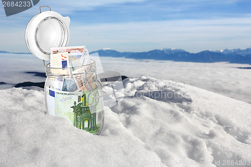 Image of Euro banknotes in the snow