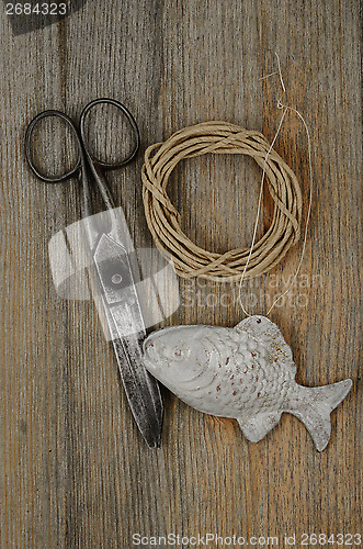 Image of old scissors, glasses, fish and hank of packthread