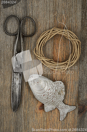 Image of old scissors, glasses, fish and hank of packthread