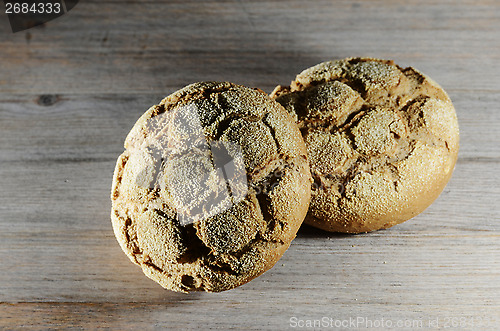 Image of loaf of rye bread on a board