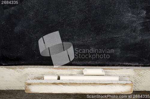 Image of blank slate blackboard and chalk