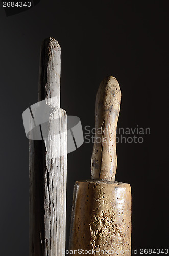 Image of two wooden phallic object