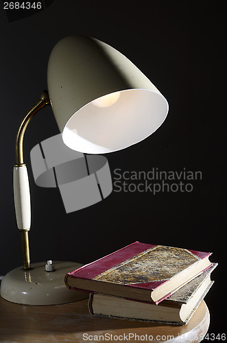 Image of vintage table lamp and a few books