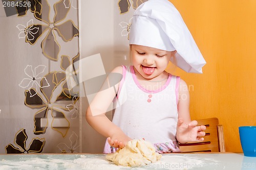 Image of baby girl in cook role