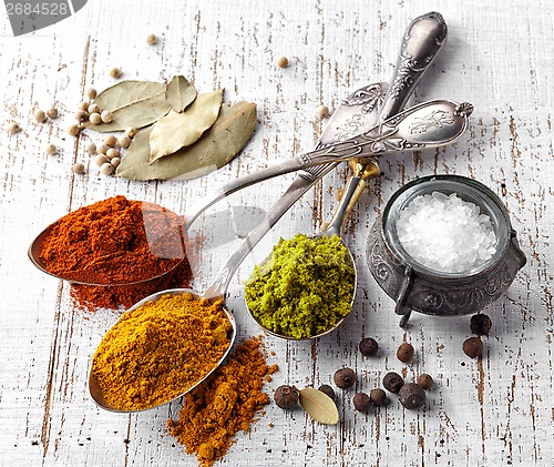 Image of various spices on a white background