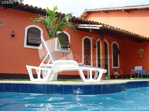 Image of Red house with swimming pool