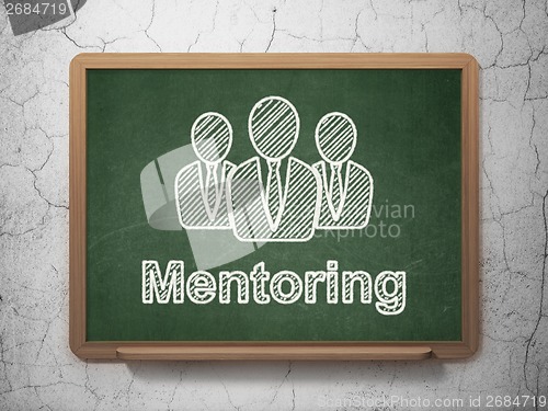 Image of Education concept: Business People and Mentoring on chalkboard background