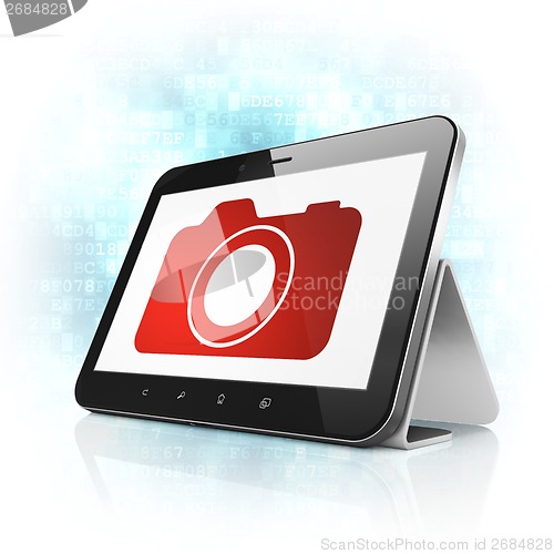 Image of Travel concept: Photo Camera on tablet pc computer