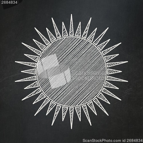 Image of Vacation concept: Sun on chalkboard background