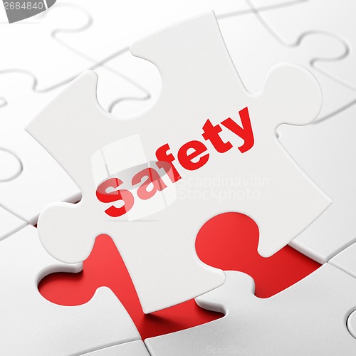 Image of Security concept: Safety on puzzle background