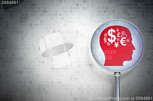 Image of Marketing concept:  Head With Finance Symbol with optical glass on digital background
