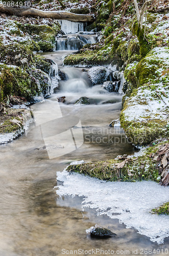 Image of Small creek with a waterfall close up