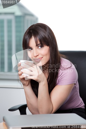 Image of Portrait Of Woman Holding Coffee Cup