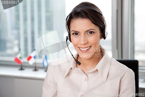 Image of Young Business Woman With Headset