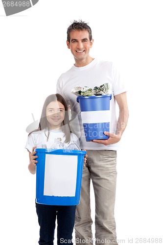 Image of Father, Daughter Holding Recycle Bin