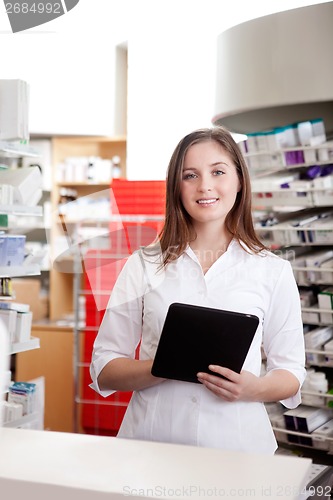 Image of Portrait Of Female Pharmacist Holding Tablet Pc