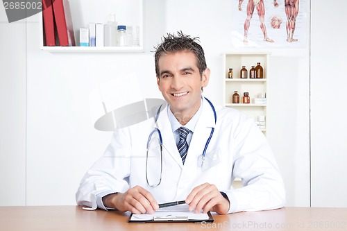 Image of Male Doctor Sitting at Desk