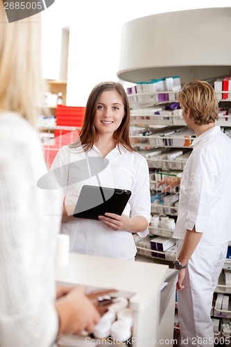 Image of Female Pharmacist Holding Tablet Pc