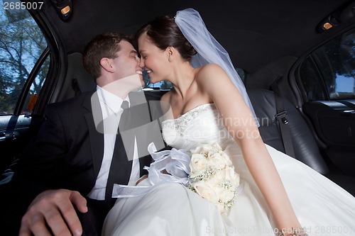 Image of Newlywed Couple In Limousine