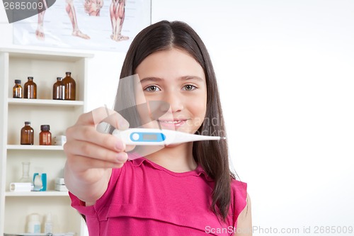 Image of Girl Showing Thermometer in Clinic