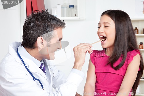 Image of Doctor Examining a Child Mouth