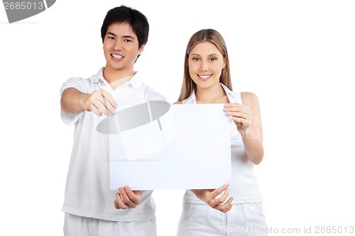 Image of Young Couple  Holding Blank Placard