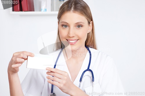 Image of Doctor Holding a Medicine Packet