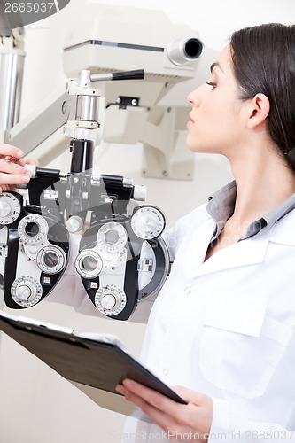 Image of Optometrist Looking At Phoropter