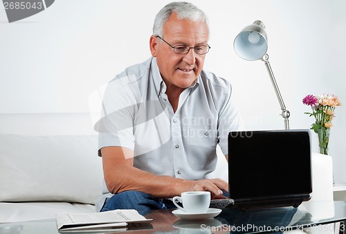 Image of Senior Man Working on Laptop