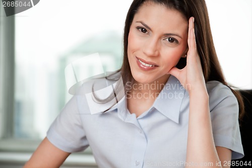 Image of Portrait Of Young Smiling Business Woman