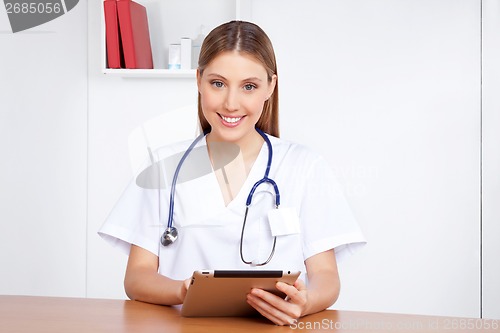 Image of Medical Professional Using Digital Tablet