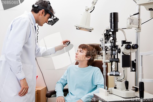 Image of Boy Undergoing Dilated Retinal Exam