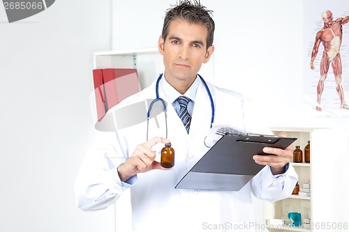 Image of Doctor Holding Clipboard and Bottle